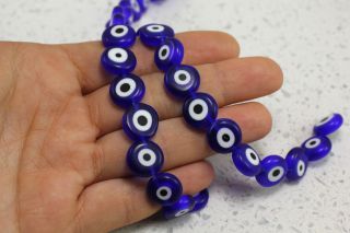 flat-round-evil-eye-beads-strand