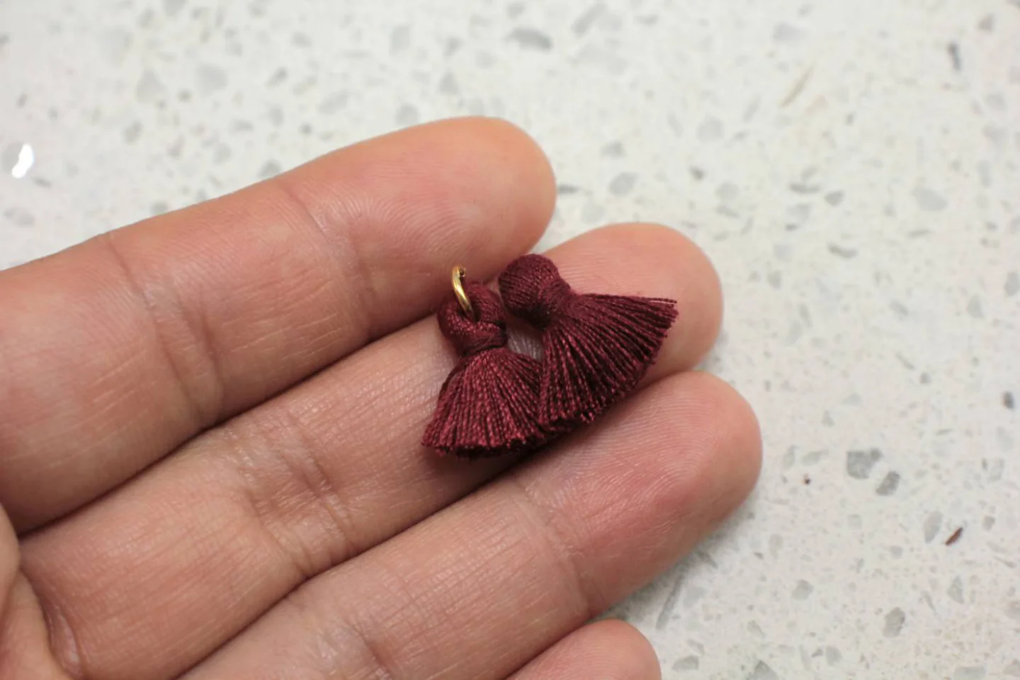 mini-cotton-tassel-with-gold-ring.