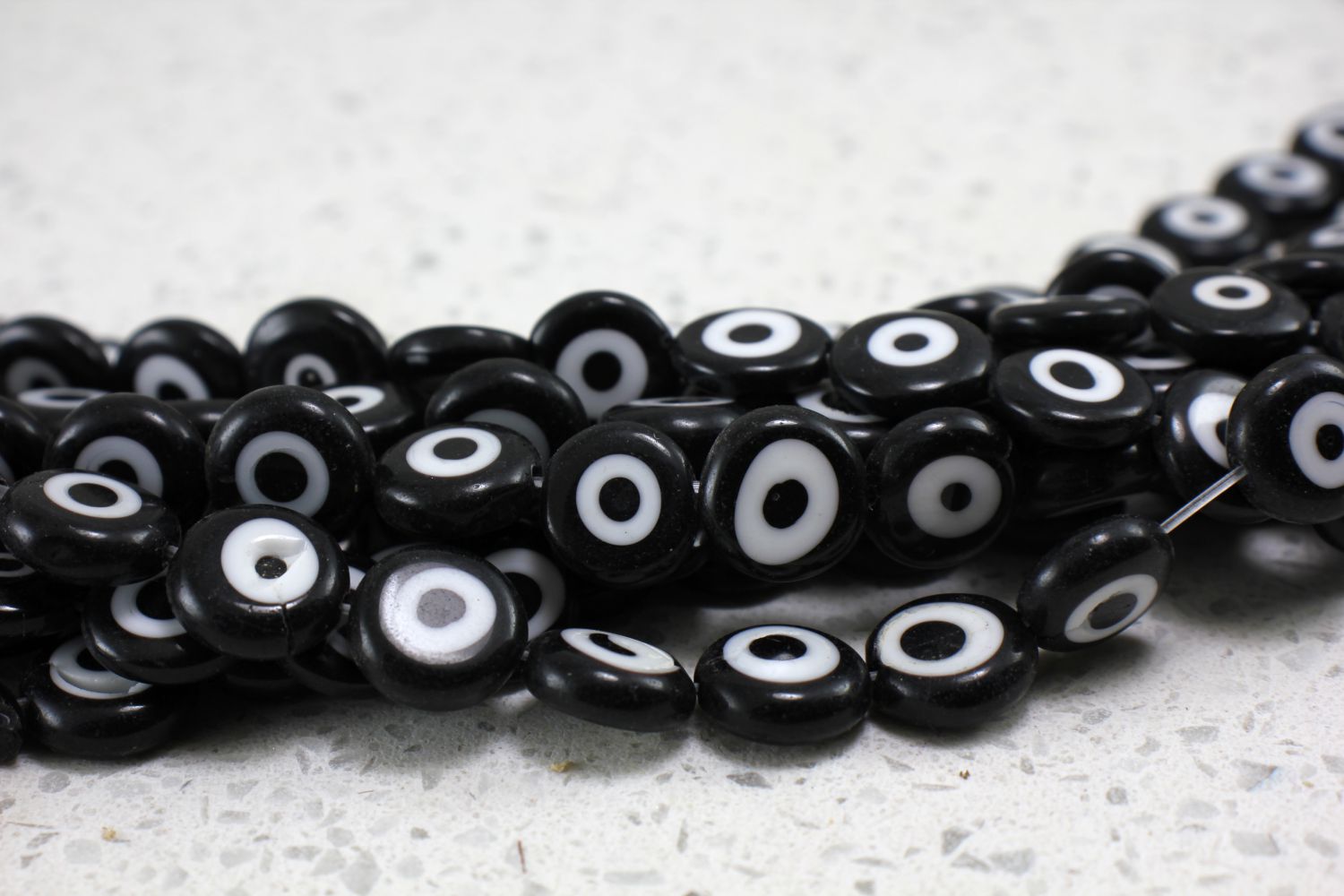 flat-round-evil-eye-beads-strand