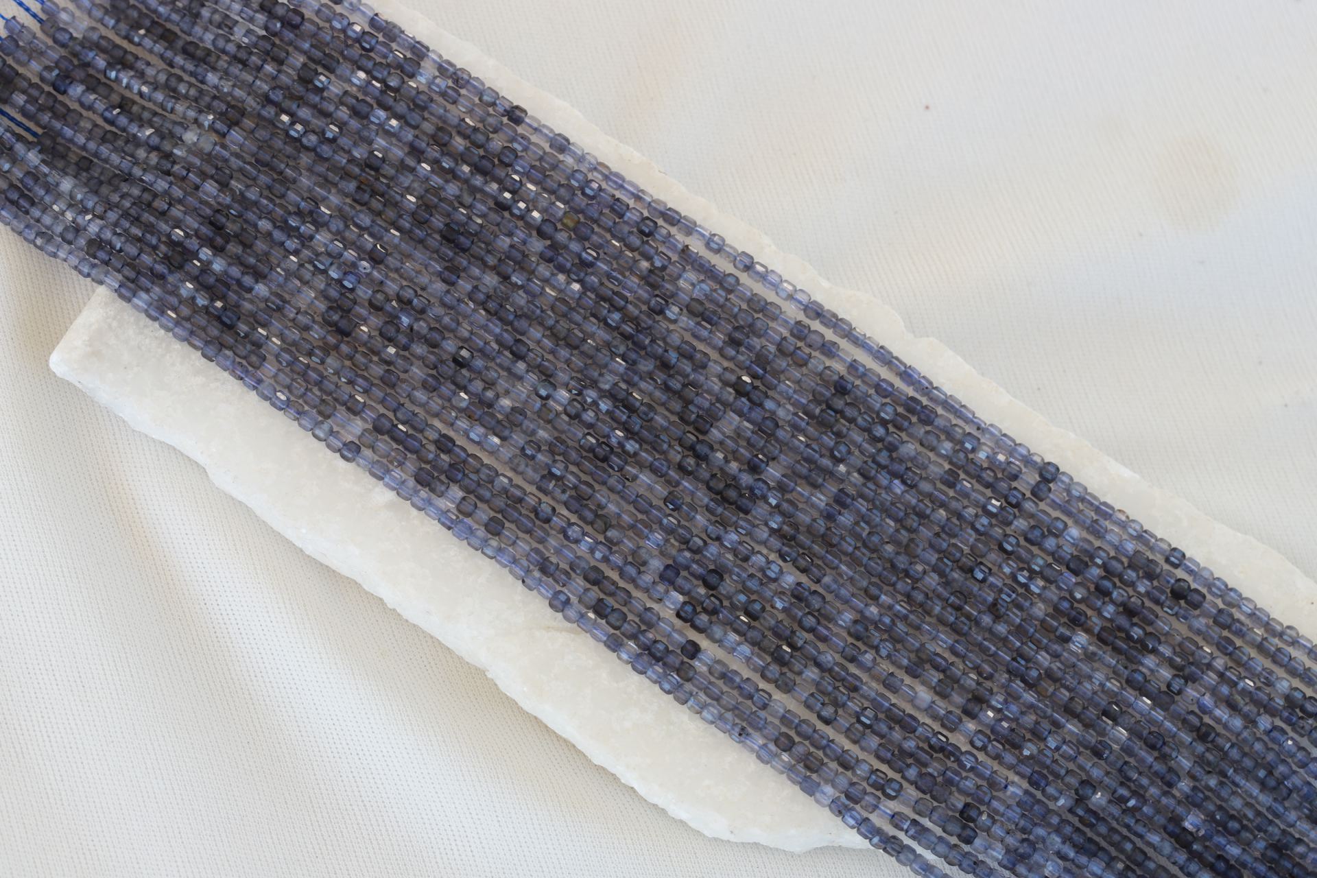 2mm-cube-faceted-lolite-beads