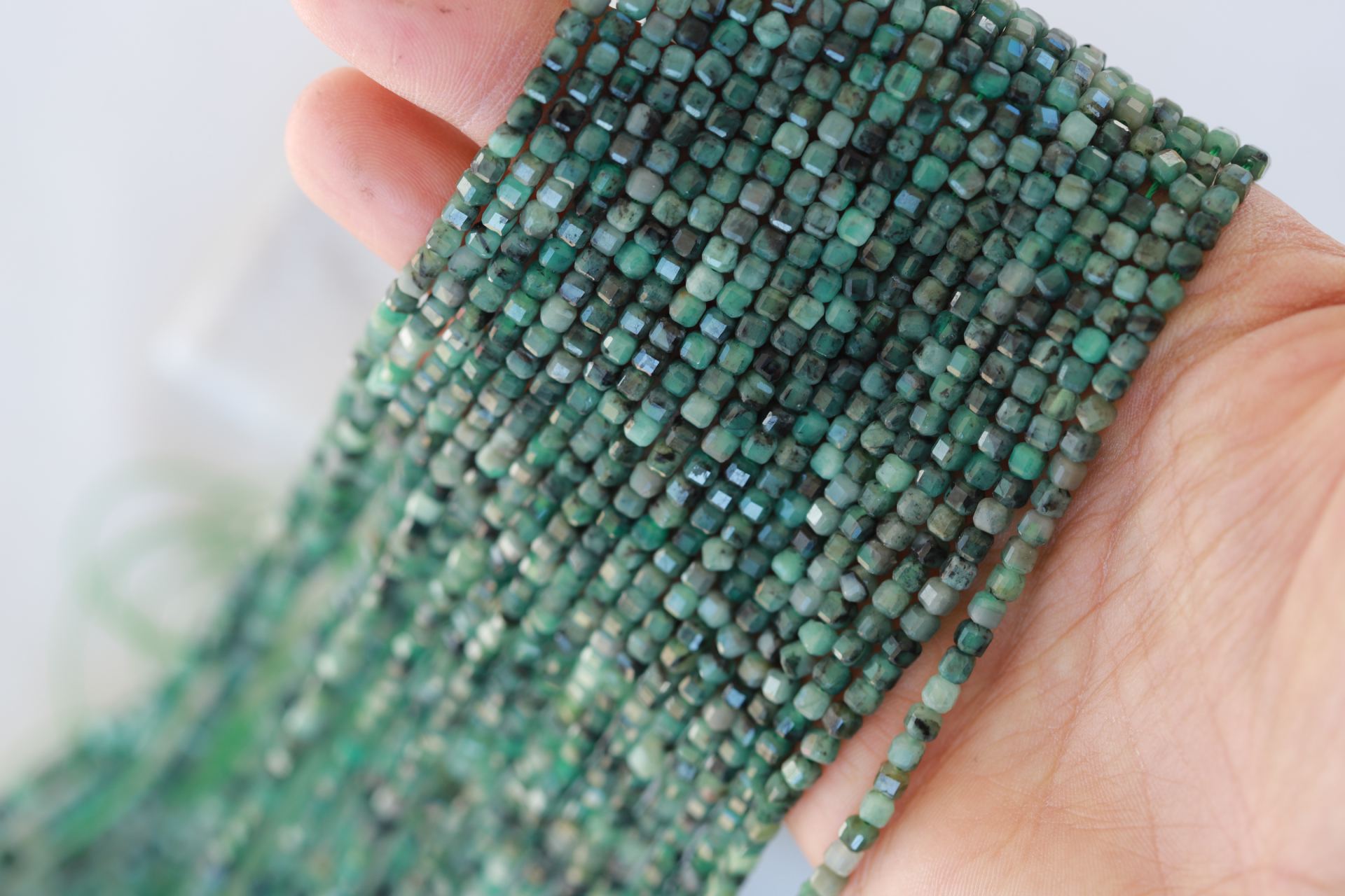 2mm-cube-faceted-emerald-beads