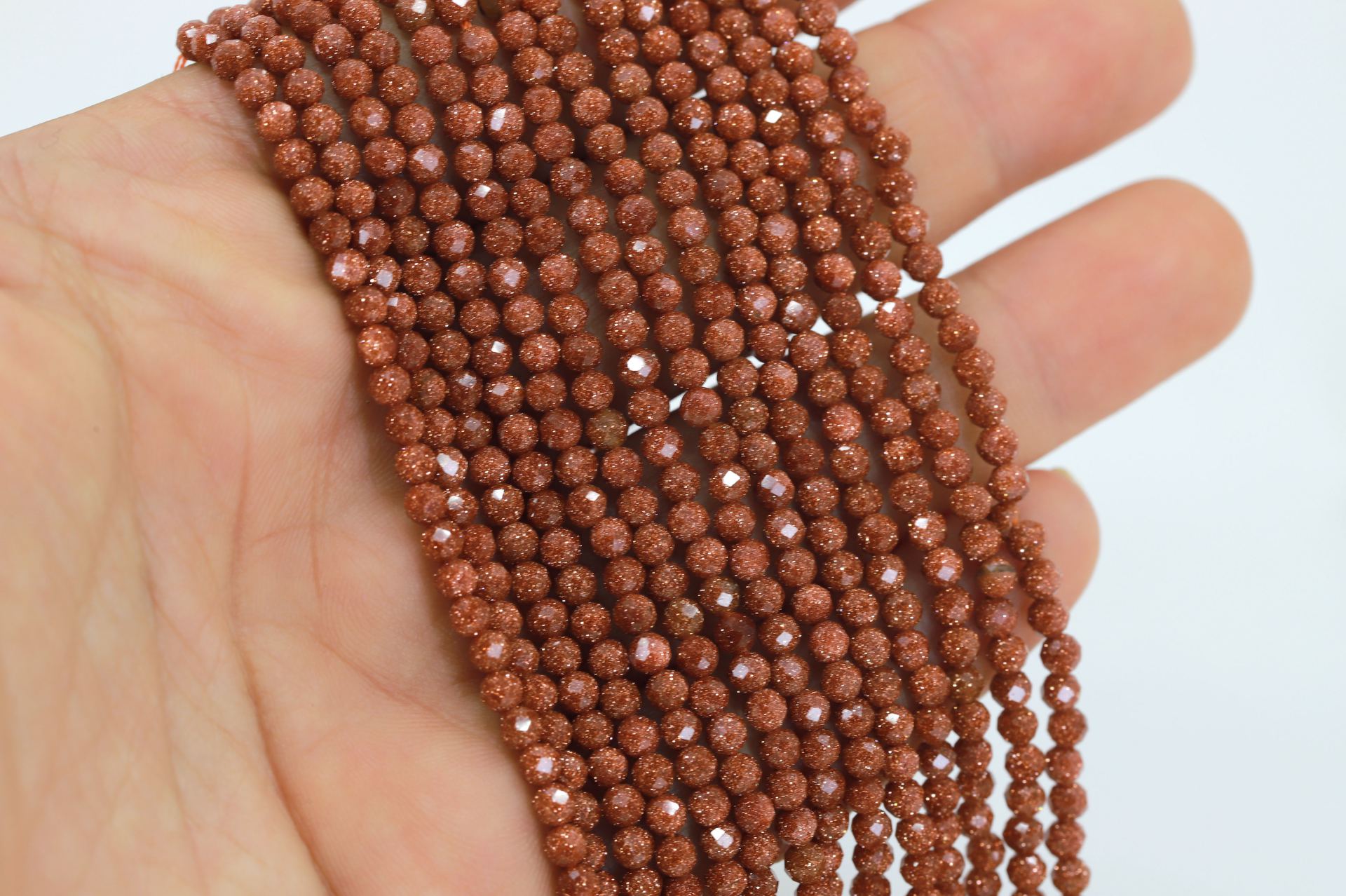 3mm-round-faceted-goldstone-beads-brown