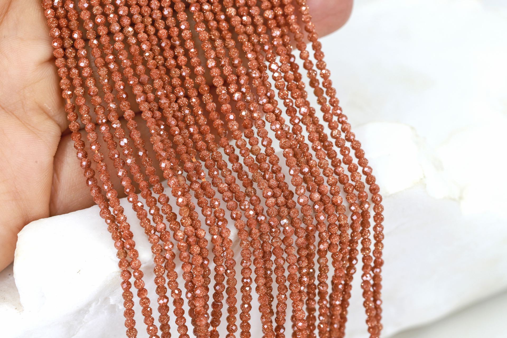 2mm-brown-goldstone-round-faceted-beads