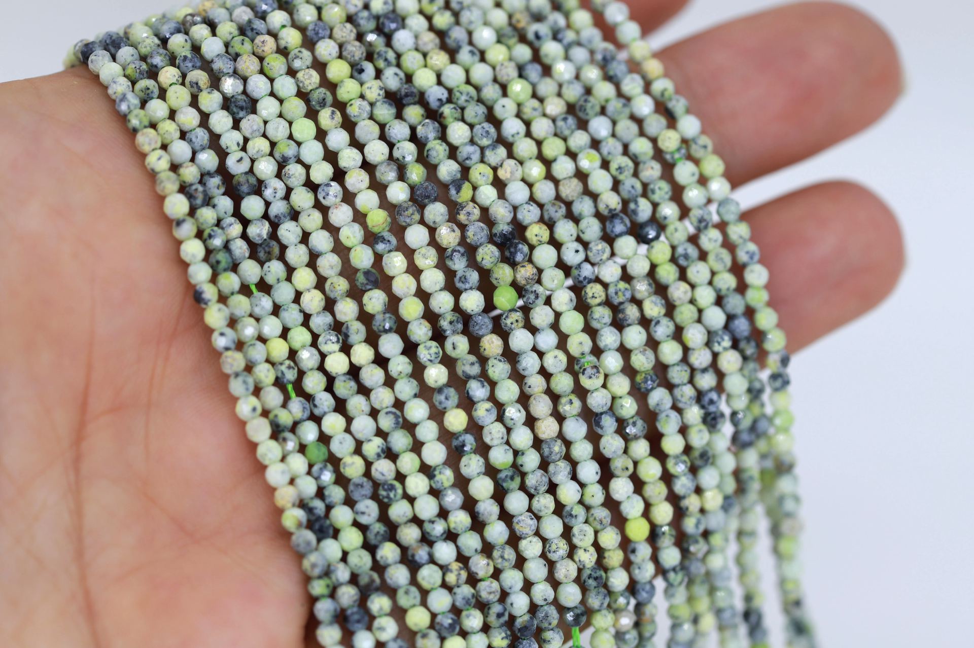 2mm-round-faceted-serpentine-beads