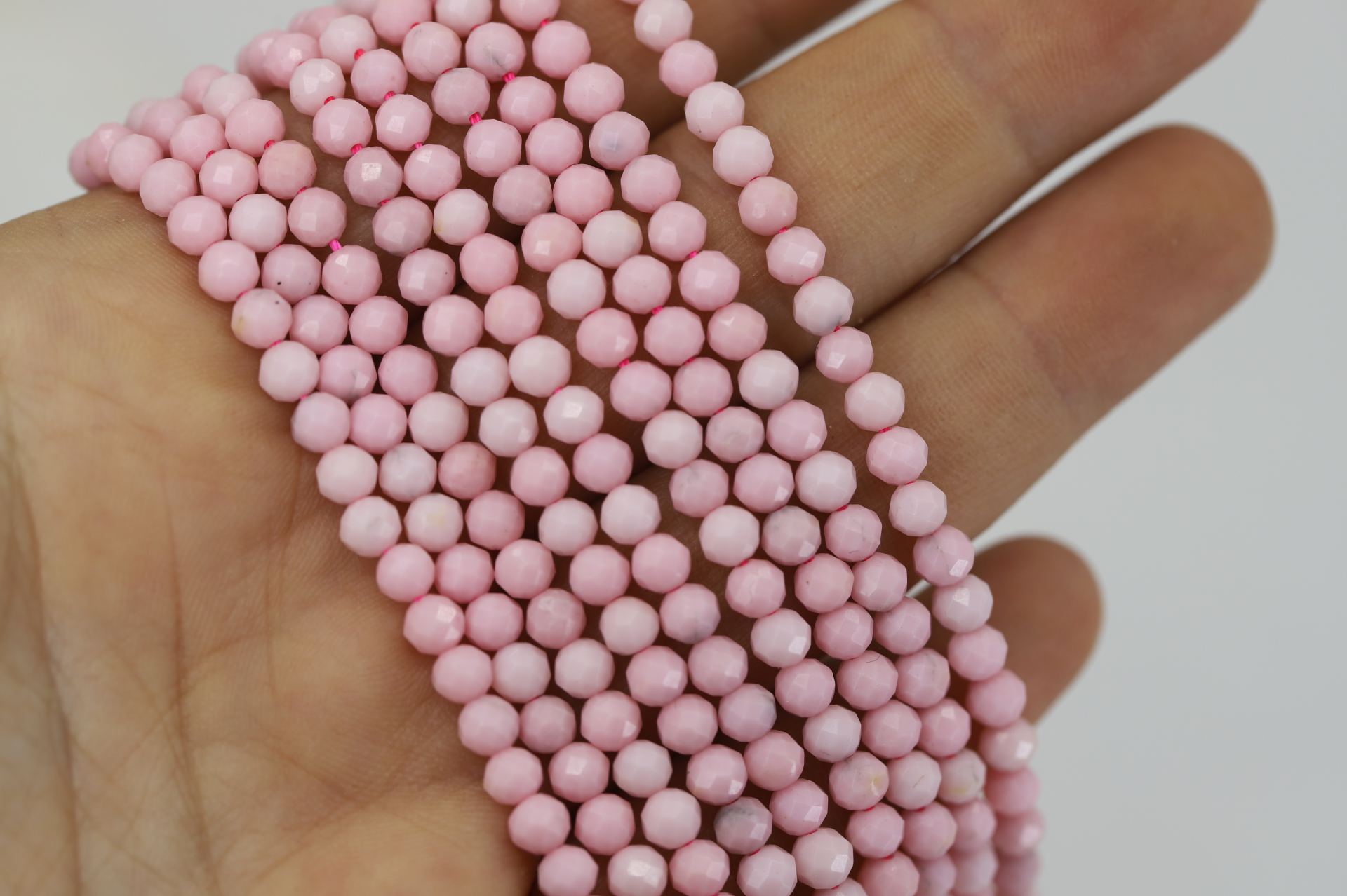 4mm-faceted-round-rhodonite-beads