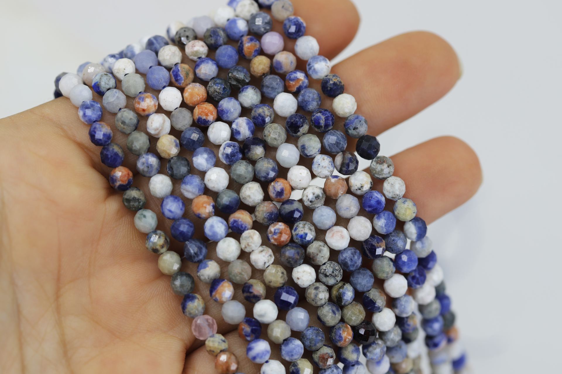 4mm-faceted-round-sunset-sodalite-beads