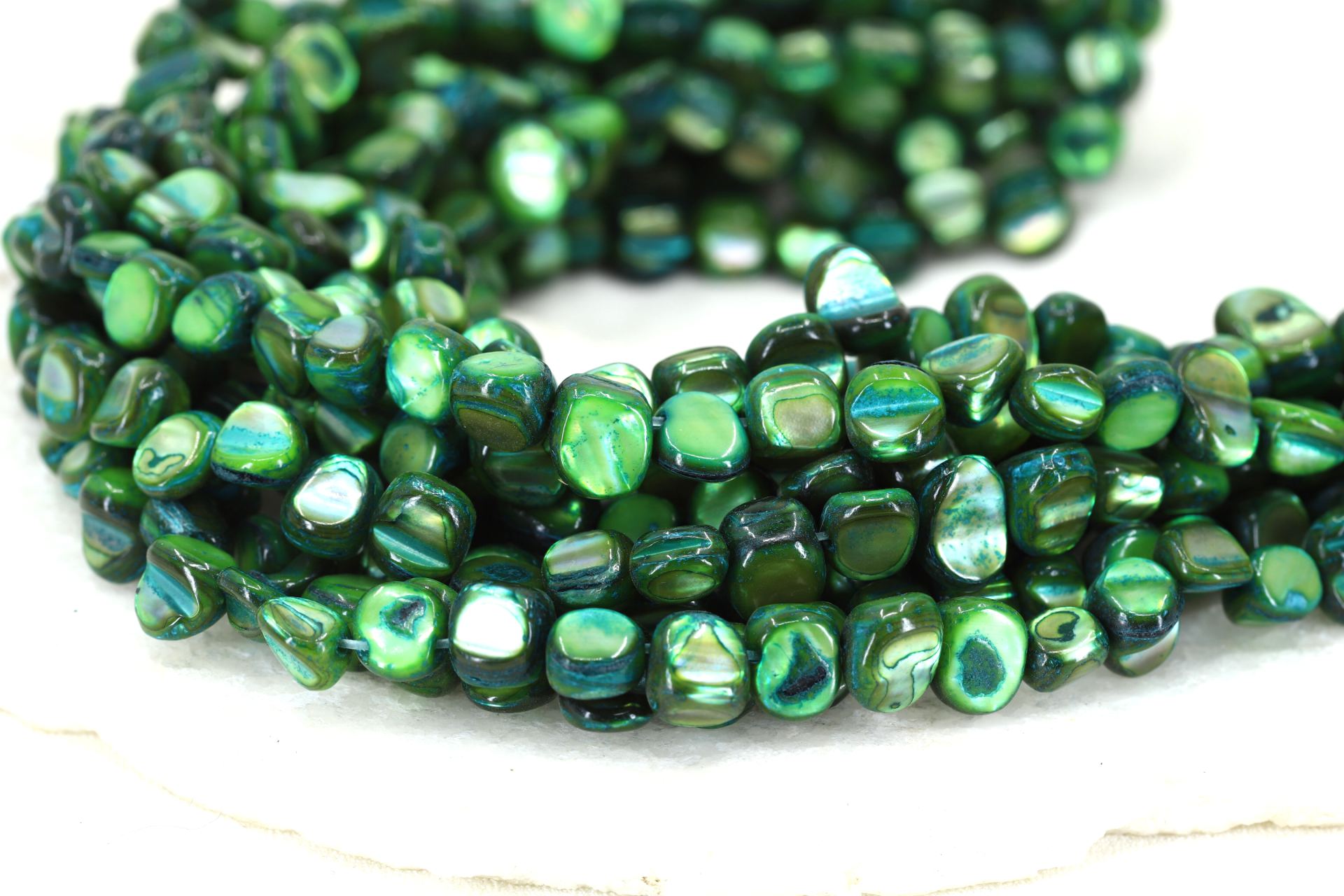 8mm-green-shell-asymmetric-flat-round