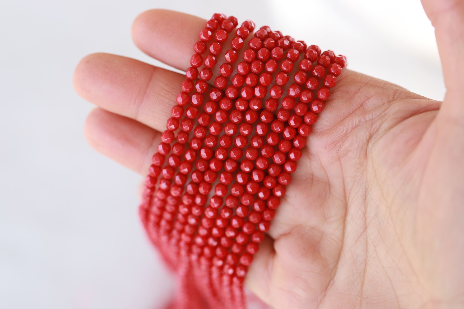 natural-coral-red-round-beads-strand
