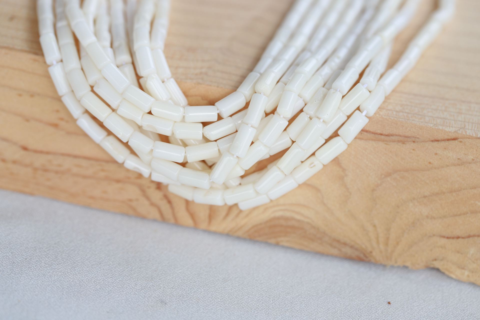 natural-coral-white-tube-beads-strand