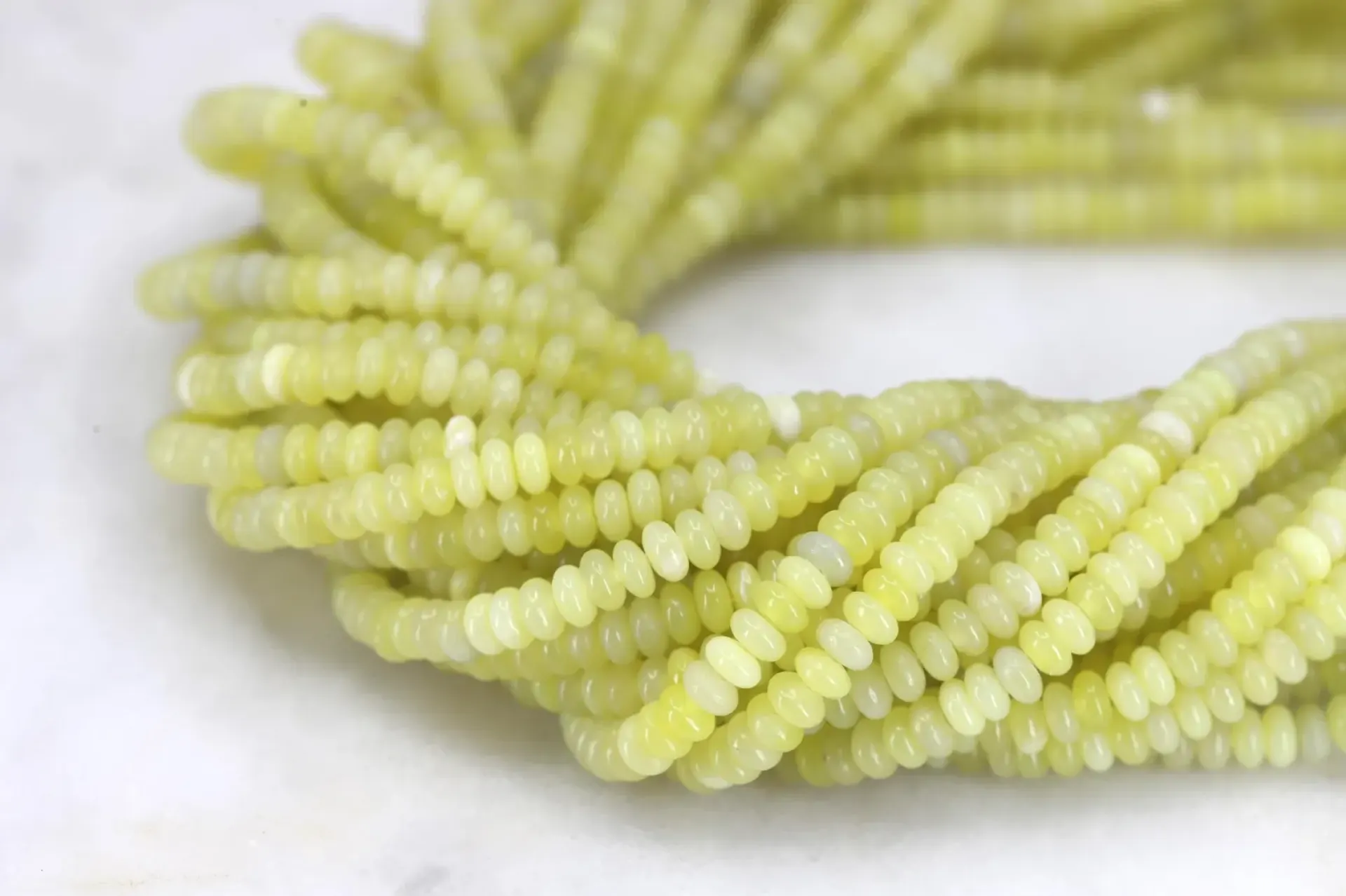 4x2mm-serpentine-yellow-bead-strand.