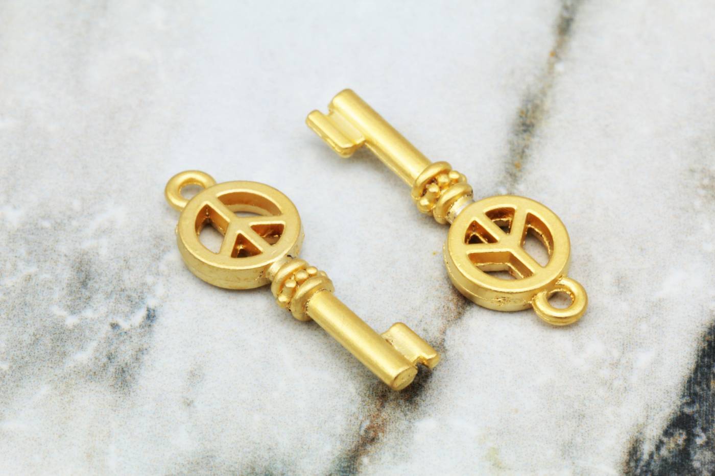 gold-metal-peace-sign-key-pendant