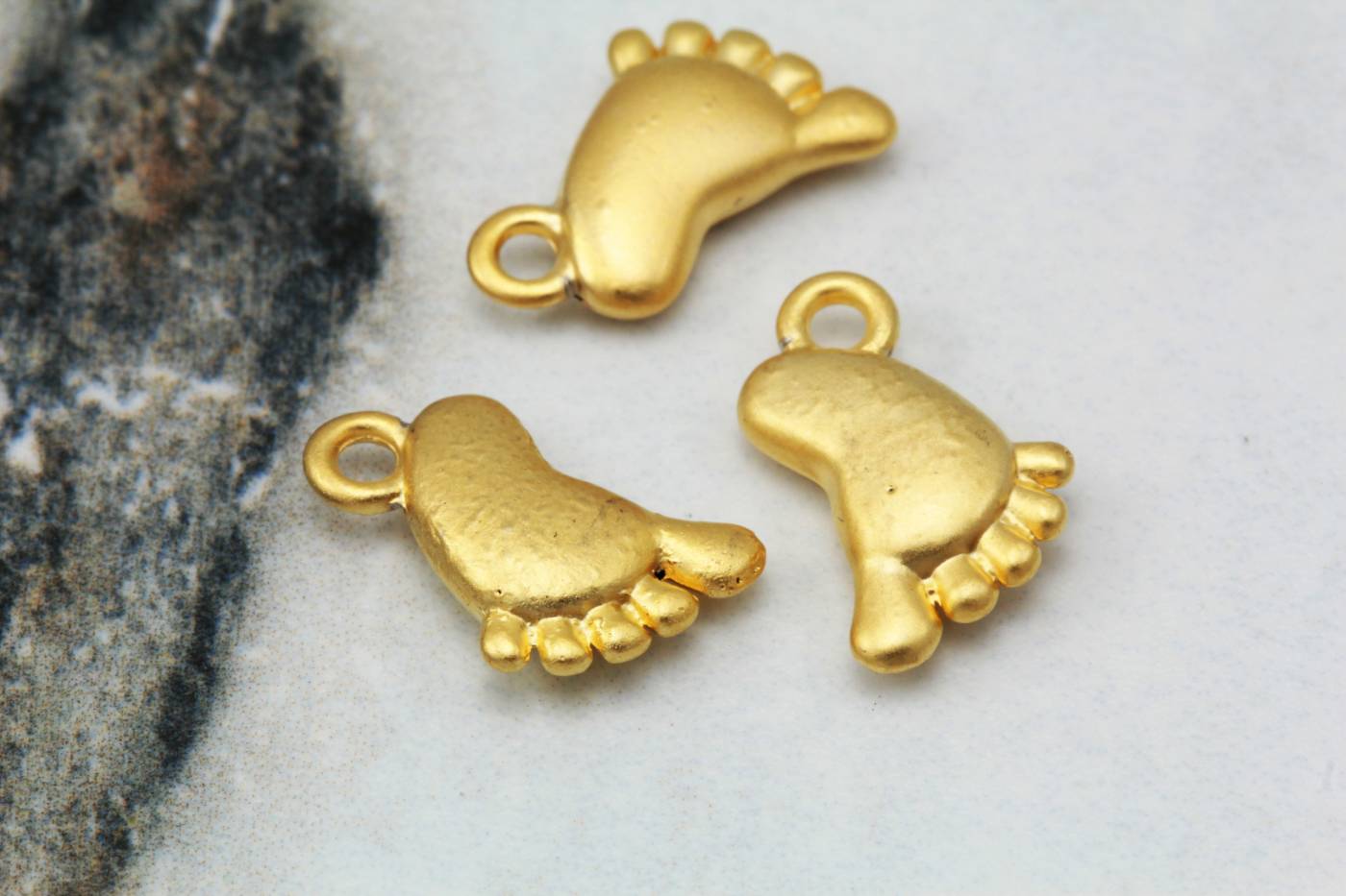 gold-metal-footprint-pendants