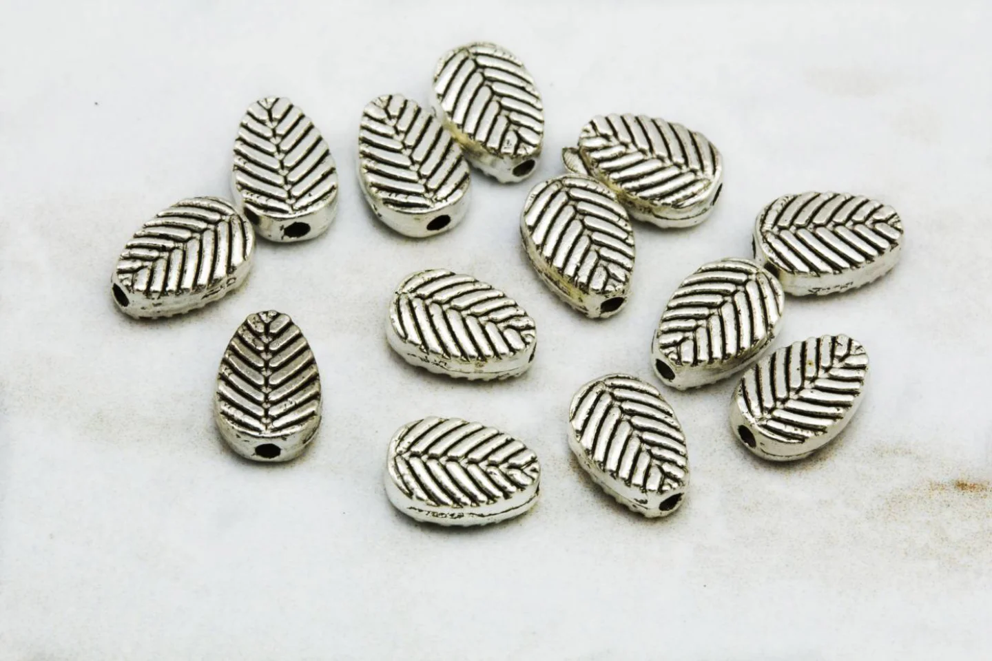 small-tiny-metal-leaf-charm-findings.